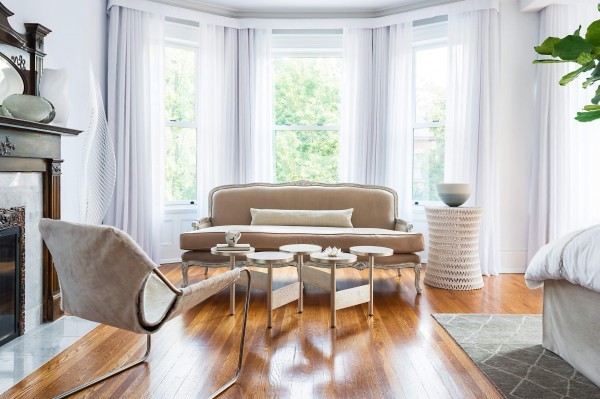 Settee with coffee table, accent chair, side table, white sheers and hardwood floor Settee with coffee table, accent chair, side table, white sheers and hardwood floor