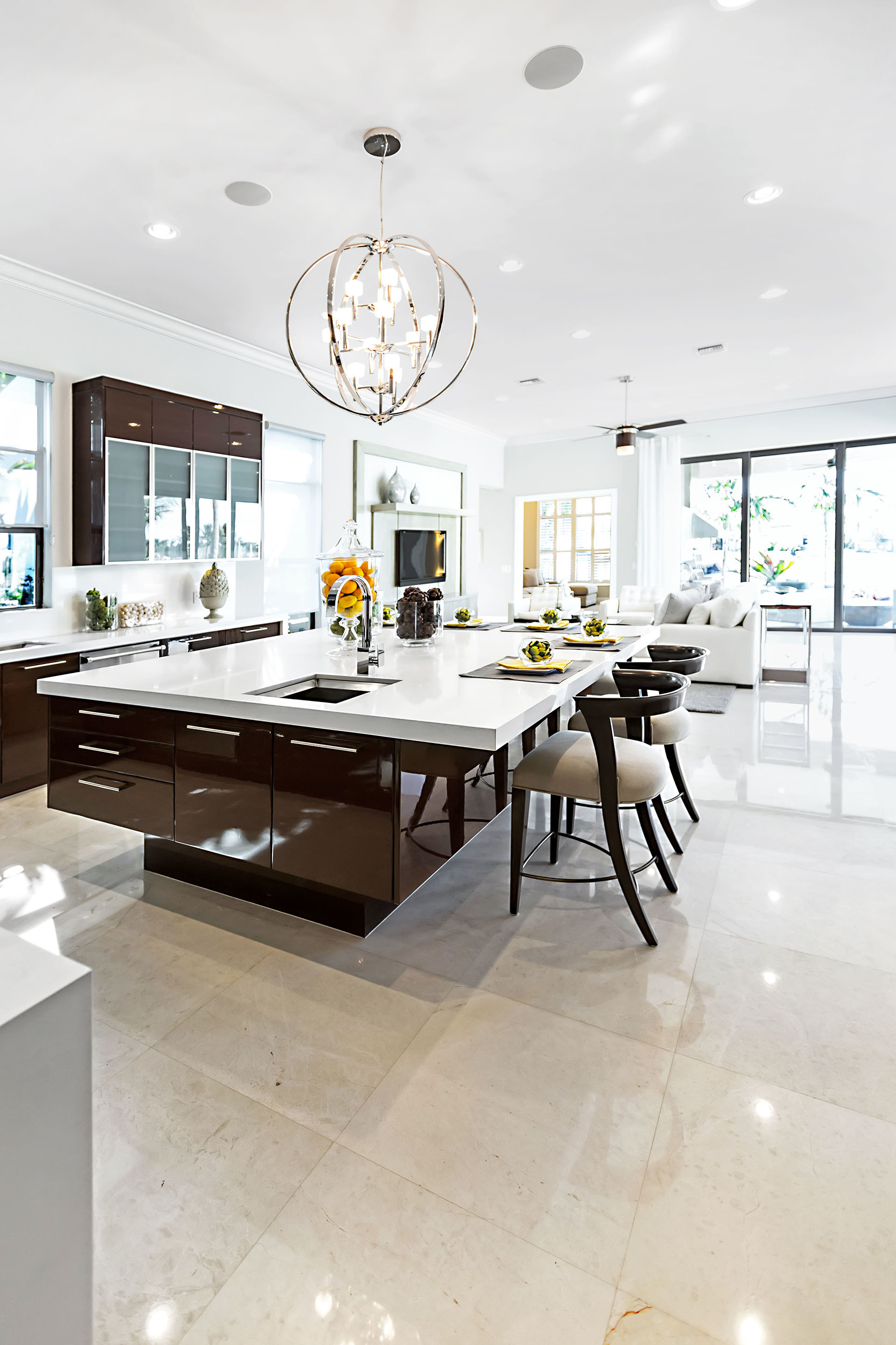 A clean and shiny modern kitchen indoors.