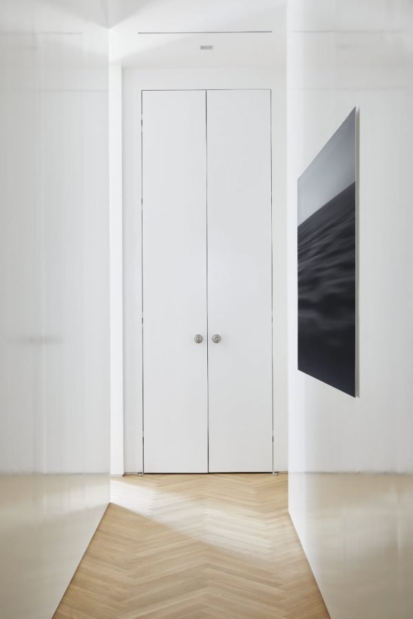 Toronto Interior Design Group, TIDG, TIDG boutique, hardwood floor, art, hardwood, high gloss walls, white walls, Chantilly Lace paint, acrylic art, trimless doors, double doors, herringbone floor, oak floor, blonde wood floor