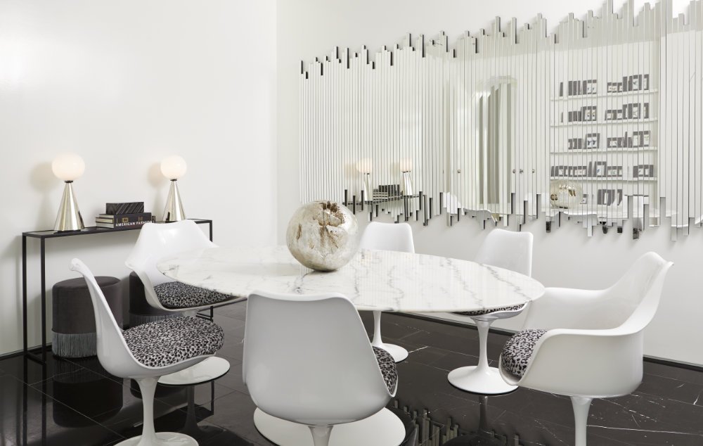 Toronto Interior Design Group, TIDG, TIDG boutique, marble table, decorative centre piece, tulip chairs, unique mirror, console, table lamps, black marble floor