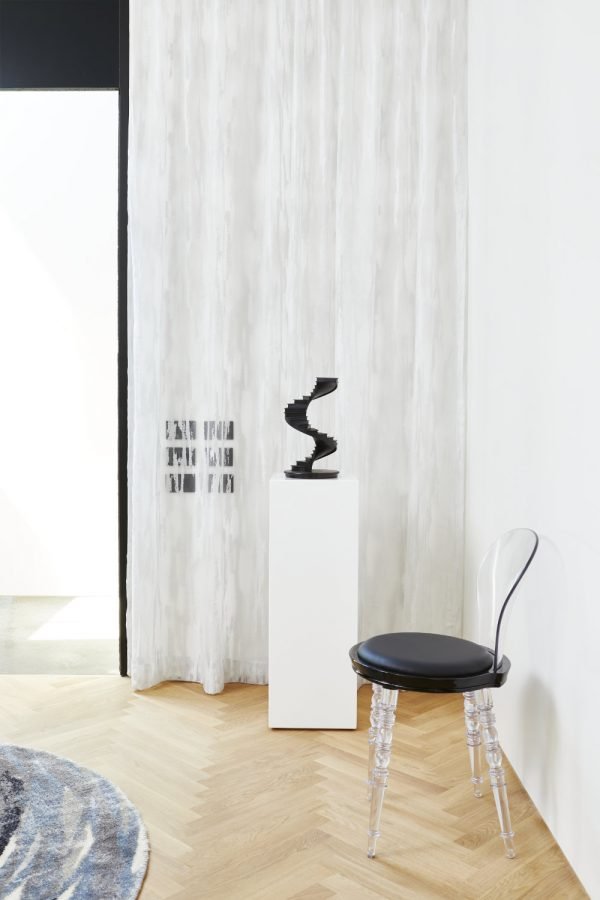 Toronto Interior Design Group, TIDG, TIDG boutique, acrylic chair, drapes, rug, decorative staircase, black switches, white walls, Chantilly Lace paint, herringbone floor, blonde wood, oak wood